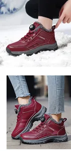 Detailed view of wine red winter snow boots featuring warm fleece lining and rotary buckle closure