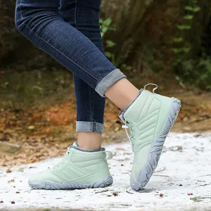 Light green insulated snow boots with fleece lining and durable gray anti-slip rubber sole