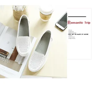 Comfortable white perforated leather loafers for women in a lifestyle setting