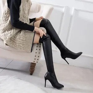 Elegant black over-the-knee boots with pointed toe and slim stiletto high heels