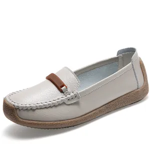 Comfortable off-white leather loafers for women with soft flat gum soles and decorative bit