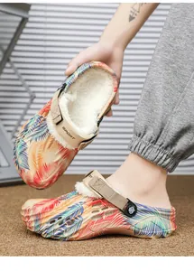Winter warm clogs featuring soft white plush lining and vibrant tropical leaf print