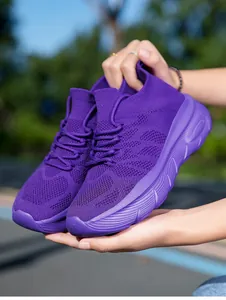 Vibrant purple flying woven sock sneakers with thick cushioned soles for casual wear