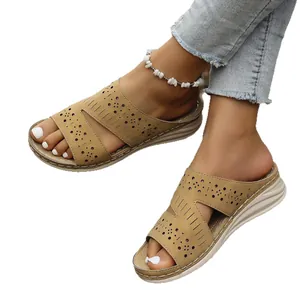Women's stylish summer platform slide sandals with laser-cut flower patterns in khaki beige