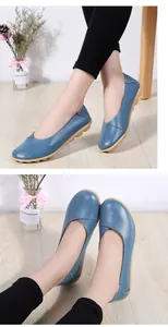Close-up detail of blue cowhide leather moccasins for women with soft rubber soles.