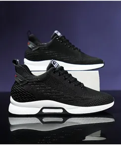Detailed side view of men's black knit elevator sneakers with thick white soles and reflection.