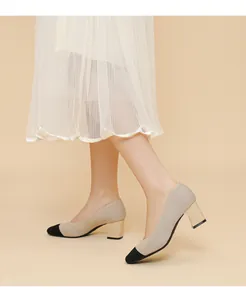 Detailed view of ribbed texture and chunky heel on elegant beige square toe pumps