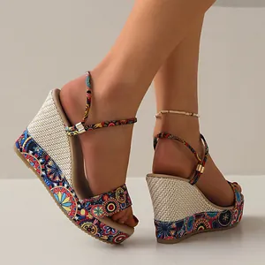Detailed view of colorful Bohemian wedge sandals with woven platform and ankle strap.