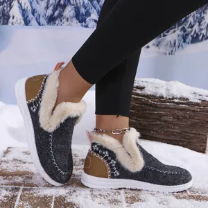 Side view of women's warm fleece-lined winter boots with snowflake embroidery