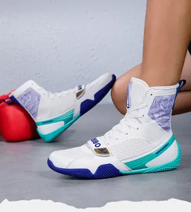 Side view detail of professional high-top white boxing shoes with breathable mesh