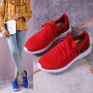 Close-up of red mesh sneakers with leopard print and model wearing the blue variant