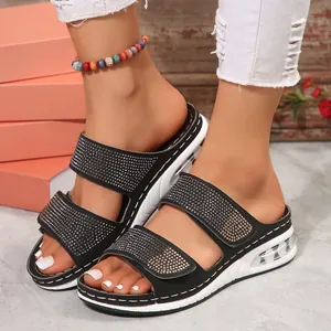 Women's black wedge sandals with rhinestone straps and cushioned platform sole