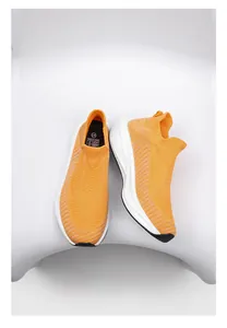 Vibrant orange flyknit sock sneakers with breathable mesh for running
