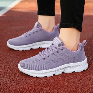 Breathable purple flyknit running shoes for women shown on a professional sports track