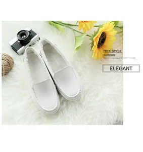 Detailed view of white leather moccasins featuring thick and warm plush faux fur lining