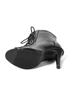 Close-up of black peep-toe lace-up stiletto dance boots showing the heel and sole.