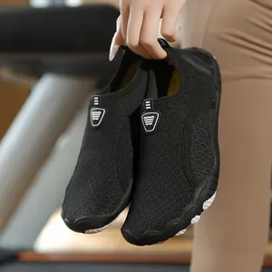 Quick-drying breathable black water shoes for surfing and beach sports held by hand
