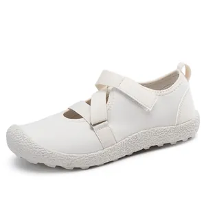 Elegant white mesh Mary Jane sneakers with velcro strap and textured sole for women