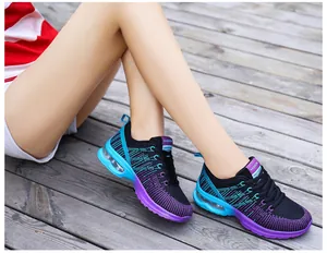 Close-up detail of women's athletic running shoes featuring gradient EVA air cushion sole.