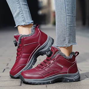 Burgundy warm winter snow boots with thick fur lining and rotary buckle system closure