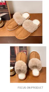 Detailed macro view of cozy tan fuzzy slippers with plush lining and thick sole