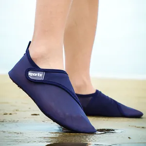 Close-up of navy blue mesh aqua shoes for beach and outdoor water activities.