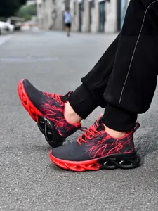 Close-up of lightweight children's red and black sports shoes in street setting