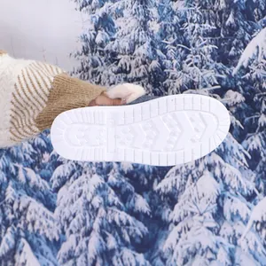 Detailed view of the durable non-slip white rubber outsole for warm winter shoes