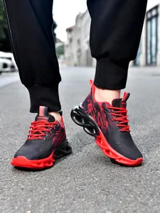 Detailed view of red and black kids sports shoes with hollow shock-absorbing soles