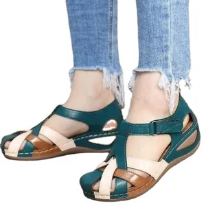Women's retro wedge sandals featuring multi-color leather cross straps and round toe