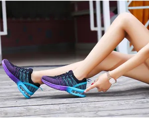 Detailed view of women's purple gradient running shoes with a cushioned air sole