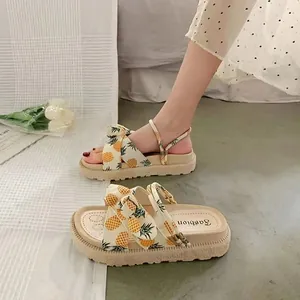 Stylish women's summer platform sandals featuring a vibrant pineapple print and thick sole.