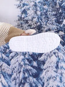 Detail showing non-slip sole pattern on women's cozy winter indoor cotton slippers