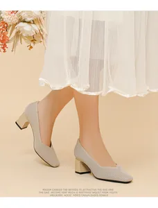 Detail of beige block heel pumps featuring a ribbed texture and elegant V-cut opening