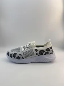 Close-up side view of women's fly-knit walking sneakers featuring stylish leopard print accents.