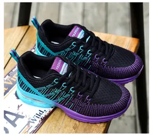 Detail view of breathable mesh women's running shoes in black, purple and teal