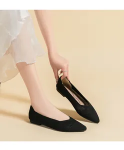 Breathable black pointed-toe knit flats featuring a stylish hollow-out mesh texture