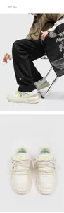 Detailed view of trendy white skate shoes featuring thick rope laces and distressed texture.