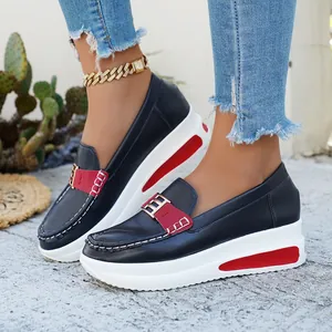 Stylish navy blue platform loafers for women with red buckle detail and thick sole