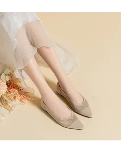 Detailed view of beige breathable knit mesh flats featuring an elegant pointed toe