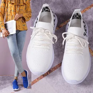 White women's breathable mesh sneakers with leopard print detail and lace-up design