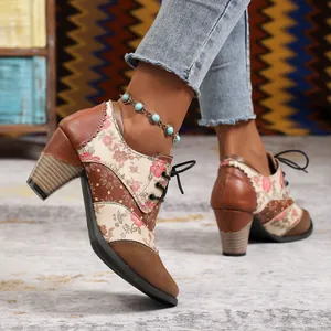 Close-up of ethnic floral patchwork chunky heel ankle boots with turquoise anklet detail