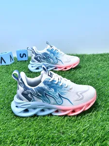 Premium lightweight shockproof children's sports shoes displayed on lush green grass
