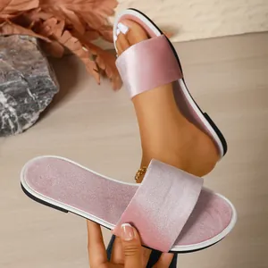 Detailed view of pink velvet flat slide sandals with non-slip sole for indoor use.