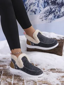 Detail of warm grey wool boots with white faux fur lining and sturdy white soles