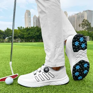Detailed view of white men's golf shoes showing spiked sole and rotary lace system