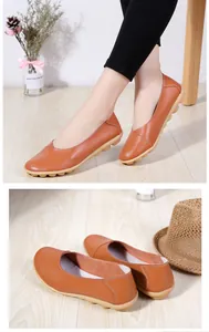 Detail view of brown leather loafers with textured surface and soft beef tendon sole