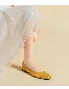 Detail view of yellow breathable mesh knit flat shoes with an elegant square toe design