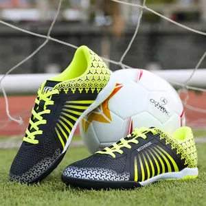 Professional men's TF turf soccer shoes with lime green accents and athletic styling