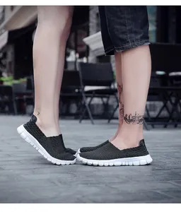 Breathable black woven slip-on loafers for couples shown in outdoor scene